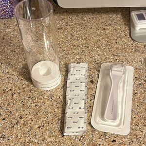 New in package Rodan + Fields AMP MD Derma-roller with 10 cleansing tablets.